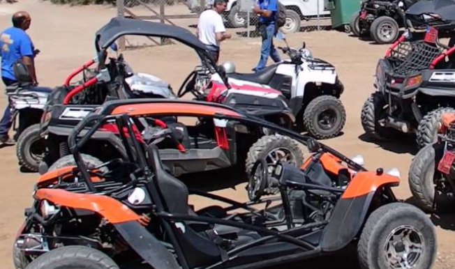 Group of riders on coastal ATVs
