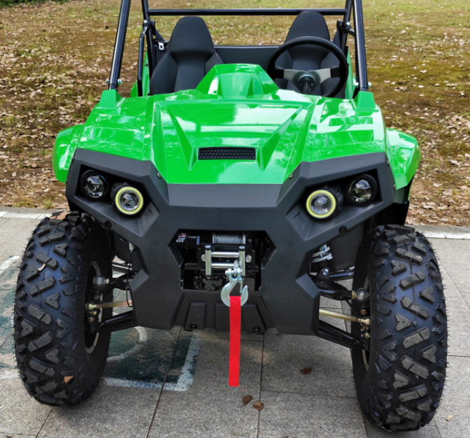 Buggy on coastal road at sunset